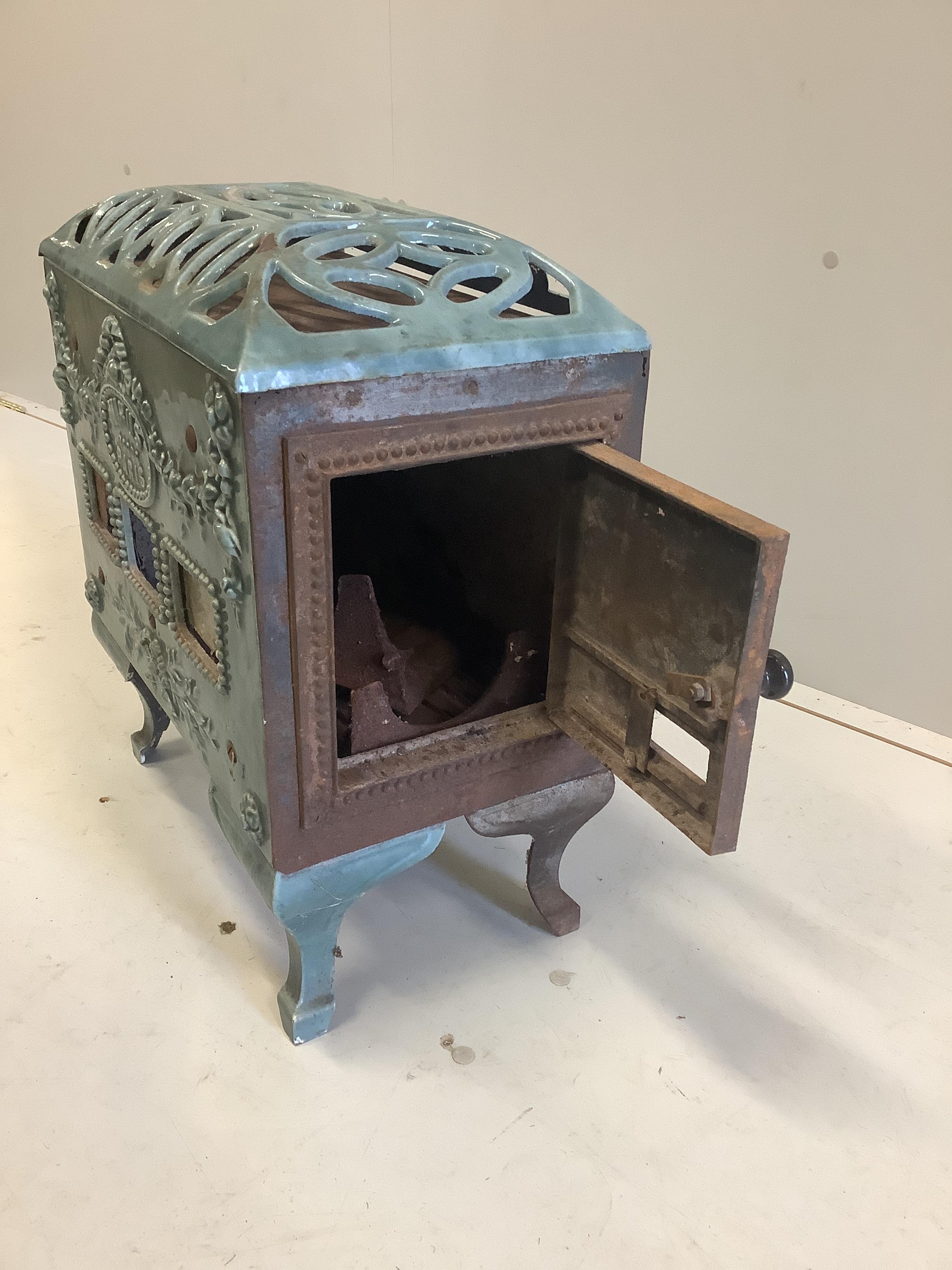 An early 20th century 'Mirus' enamelled cast iron heater, width 47cm, depth 26cm, height 54cm